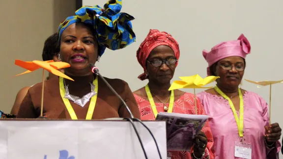 Presenting the Womenâs Message at the Africa Pre-Assembly symbolized by the four wings of a windmill are (from left) Faustina Manyangu (Evangelical Lutheran Church in Tanzania), Council member Titi Malik (The Lutheran Church of Christ in Nigeria), and Rev. Dr Jeannette Ada Maina (Evangelical Lutheran Church of Cameroon). Photo: LWF/A. WeyermÃ¼ller