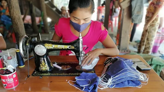 A woman entrepreneur sews cloth face masks in Sittwe, Rakhine State, Myanmar. Photo: LWF/Nu Nu Aye