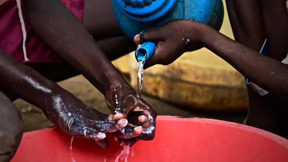 Children demonstrate hand washing at Kakuma refugee camp; Kenya. LWF has reinforced hygiene education to prevent a spread of COVID-19 in the camp. Photo: LWF/ P. Omagwa