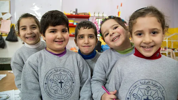 Students from the kindergarten of the Evangelical Lutheran School in Beit Sahour take a break from learning their Arabic alphabet to pose for a photo. Photo: ELCJHL