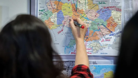 A woman marks on a map what part of Ukraine she comes from, LWF staff – most them refugees from Ukraine – gather for the training in Bytom, Poland. Photo: LWF/Albin Hillert