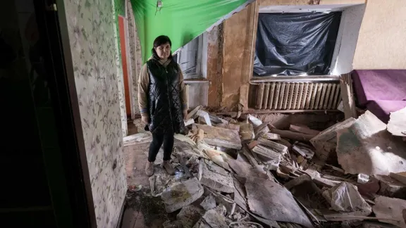 41-year-old Victoria Hlushko pictured in what used to be the living room of her family home in the village of Bil’machivka. Photo: LWF/ Albin Hillert