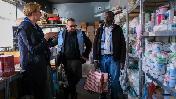 Izabela Kucmin-Bemelmans (The Polish Scouting and Guiding Association and the Internationaler Bund Polska), Łukasz Ostruszka (Evangelical-Augsburg Parish) and Julius Kibet (Foundation LWF in Poland) at the distribution center of Daszyńskiego street 16, Cracow. Photo:LWF/ L. Gillabert 