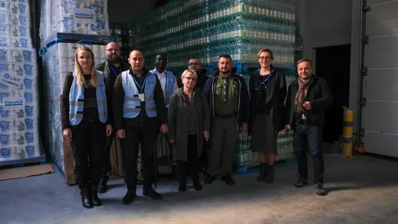 LWF and partners, from left: Anna Pilch (Foundation LWF in Poland), Mateusz Ploskonka (City of Cracow), Samuel Dypczyński Foundation LWF in Poland), Julius Kibet (Foundation LWF in Poland), Joanna Godfrejów (Parish Council of the Evangelical-Augsburg Parish), Łukasz Ostruszka (Evangelical-Augsburg Parish), Mariusz Siudek (The Polish Scouting and Guiding Association), Izabela Kucmin-Bemelmans (The Polish Scouting and Guiding Association), Grzegorz Grzonka (Internationaler Bund Polska) in the Cracow warehouse