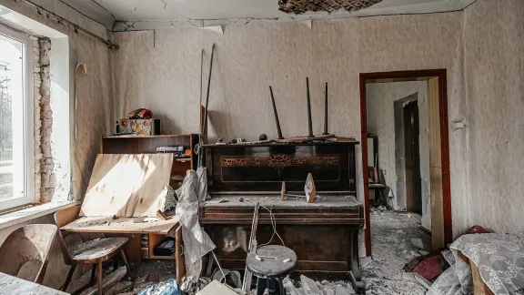 A living room in the Saltivka quarter, Kharkiv. The apartment blocks continue to be targeted by missiles. Photo: LWF/ Anantoliy Nazarenko