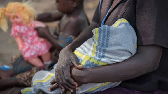 A woman with her children at the Iboa Health Centre, Obongi district of northern Uganda, where LWF and Medical Teams International provide support to malnourished refugee children and mothers. Photo: LWF/Albin Hillert .