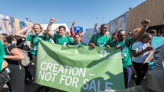 Young delegates from the Lutheran World Federation join hundreds of people from civil society organizations and faith communities across the globe to march through the venue of the United Nations climate change conference COP27 in Sharm el-Sheikh, Egypt, calling for climate justice and urgent action. Photo: LWF/Albin Hillert