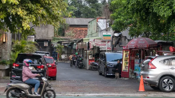 People go about their day on a street in the central district of Jakarta. Photo: LWF/Albin Hillert