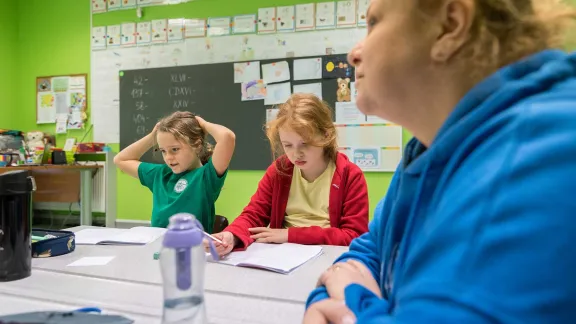 Ukrainian children in a school in Gliwice, Poland. For many families, sending their children to a local school is the first step towards integration. Photo: LWF/ Albin Hillert