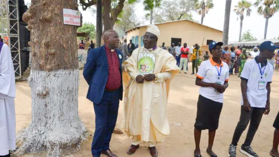 EFLC President Rev. Alvius Debsia Dabah (right) and Second Vice-President Rev. Zacharie Mounkine (left), with youth members of the church. Photo: EFLC/ Moise H. Loumkoua