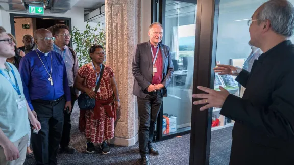 Staff of the LWF Communion office welcome President Henrik Stubkjær and Council members to the new premises near Geneva airport. Photo: LWF/A. Hillert