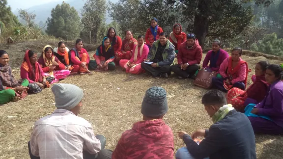 Mr. Man Khatri (in green jacket) interacting with cooperative members from freed Haliya communities at Budar of Doti district. Photo: LWF Nepal