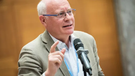 Oberkirchenrat Norbert Denecke in conversation during the LWF Council meeting in 2018 which was held in Geneva. Photo: LWF/Albin Hillert