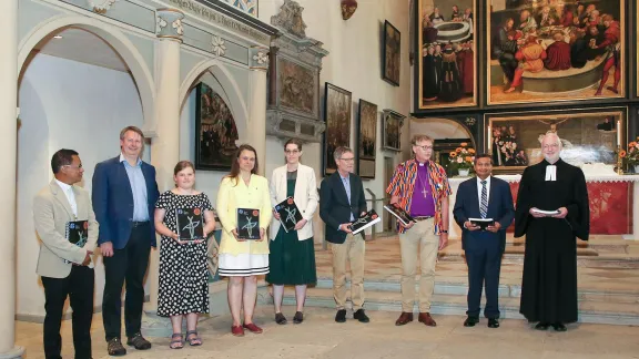 Representatives of churches with the first copies of the songbook. Photo: GNC/Cornelia Kirsch