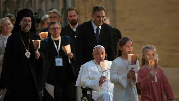 Prof. Dirk Lange and other ecumenical delegates follow behind Pope Francis at the Ecumenical Vigil with Synod participants. Photo: CatholicPressPhoto/A. Giuliani