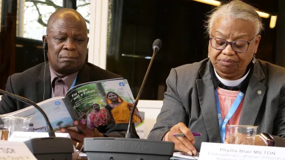 Presentation of the LWF's humanitarian and development work in World Service. Bishops Eduardo Matsimbe (Evangelical Lutheran Church in Mozambique, left) and Phyllis Blair Milton (ELCA) study the new LWF World Service strategy. Photo: LWF/ C. Kästner-Meyer