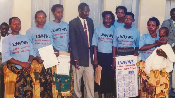 1998: Counseling courses for awareness building among HIV/AIDS affected persons. In this picture, newly trained LWF volunteer counselors are being awarded certificates after completing their one-year counseling courses. Photo: LWF Uganda