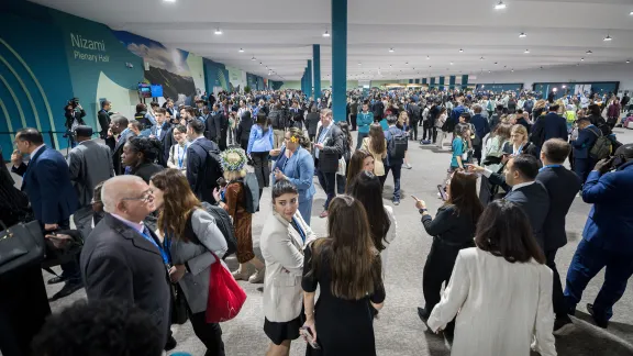 People from all over the world pictured at the COP29 venue as events ready to unfold on opening day..Photo: LWF/Albin Hillert