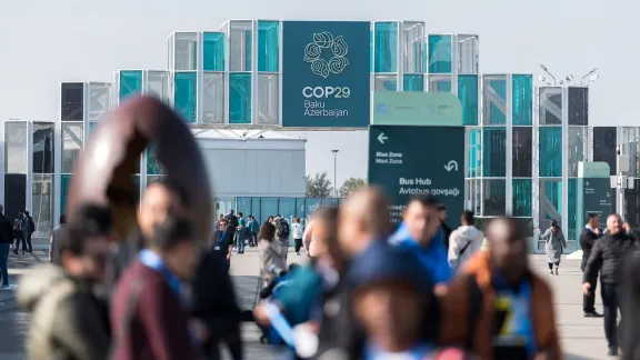 People arrive for the United Nations climate summit COP29, which takes place in Baku, Azerbaijan, on 11-22 November 2024. Photo: LWF/Albin Hillert