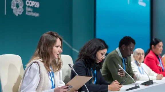 Carine Wendland from Brazil speaks at a press conference during COP29. Photo: LWF/Albin Hillert