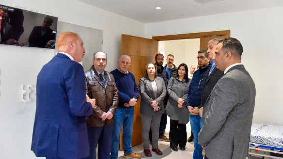 Dr Fadi Atrash, CEO of the AVH (left), leads representatives of the municipality and staff around the new clinic. Photo: AVH