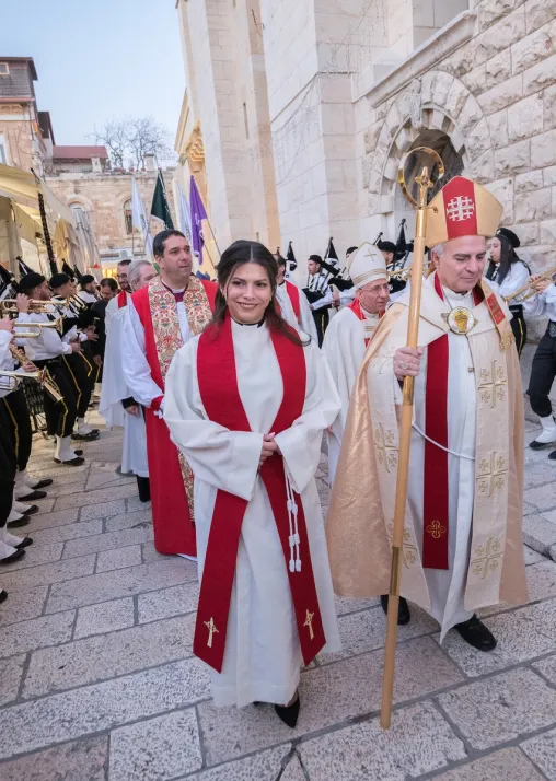 22 January 2023, Jerusalem, Palestine: Rev. Sally Azar, ordained minutes earlier as pastor in the Evangelical Lutheran Church in Jordan and the Holy Land, exits the church in procession together with her Bishop Sani Ibrahim "Barhoum" Azar. Photo: LWF/ Albin