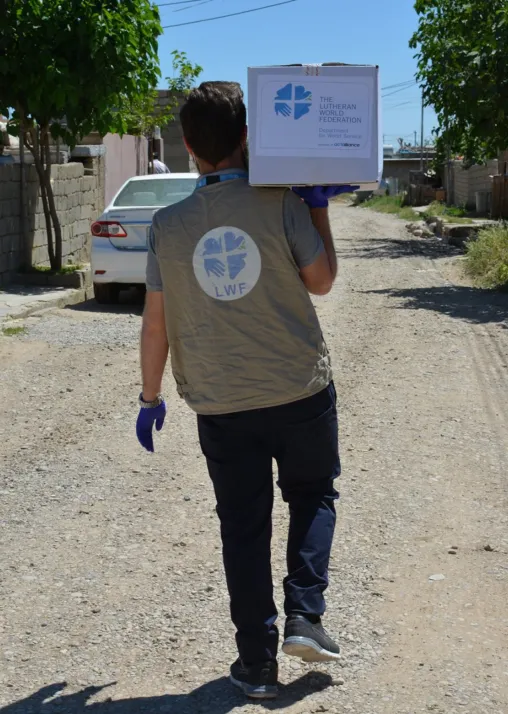 In the World Service country programs, international and national staff, incentive workers, and volunteers support refugees and internally displaced people and host communities. At the height of the COVID-19 pandemic in Iraq, for example, LWF staff distributed food and other basic supplies to vulnerable families in Summel District in Dohuk Governorate. Photo: LWF Iraq